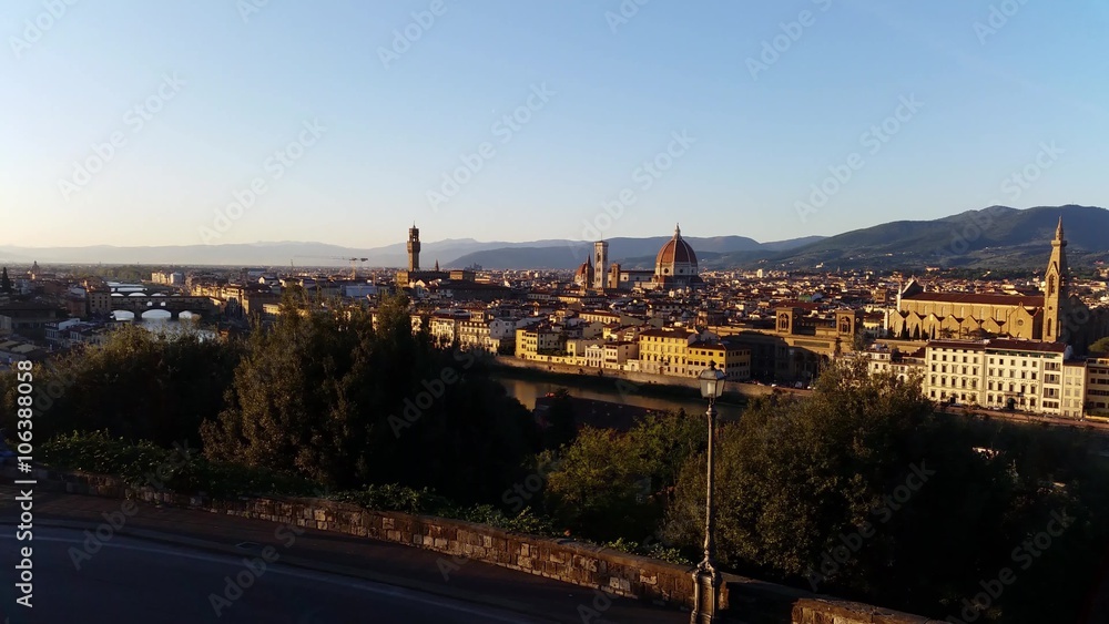 Florence, Italy view from Piazzale Michelangelo, a square with a panoramic view of Florence (Firenze). Visible is the city with river Arno, The Ponte Vecchio arch bridge and the Duomo of Florence. Florence, Italy view from Piazzale Michelangelo, a square with a panoramic view of Florence (Firenze). Visible is the city with river Arno, The Ponte Vecchio arch bridge and the Duomo of Florence.
