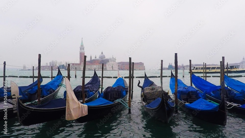 Gondolas in Saint Mark's square (San Marco) with The Church of San Giorgio Maggiore in the background Gondolas in Saint Mark's square (San Marco) with The Church of San Giorgio Maggiore in the background