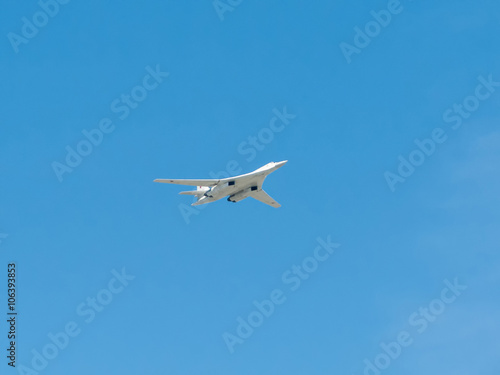 Tupolev Tu-160 (Blackjack) supersonic variable-sweep wing heavy strategic bomber flies on blue sky background 