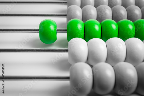 Abstract of wood abacus, focus at green color
