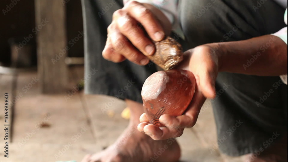 Experience the traditional art of pottery making in the Ecuadorian Amazonia as an adult woman puts the finishing touches on her rural masterpiece. Experience the traditional art of pottery making in the Ecuadorian Amazonia as an adult woman puts the finishing touches on her rural masterpiece.