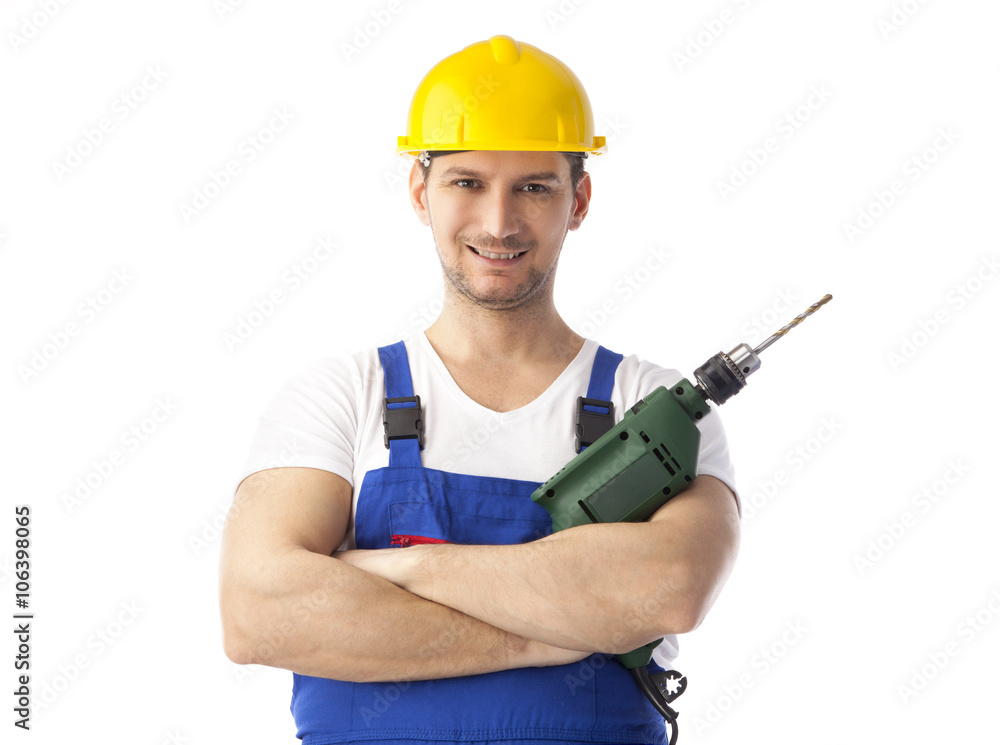 Smiling handyman holding drill machine Smiling handyman holding drill machine
