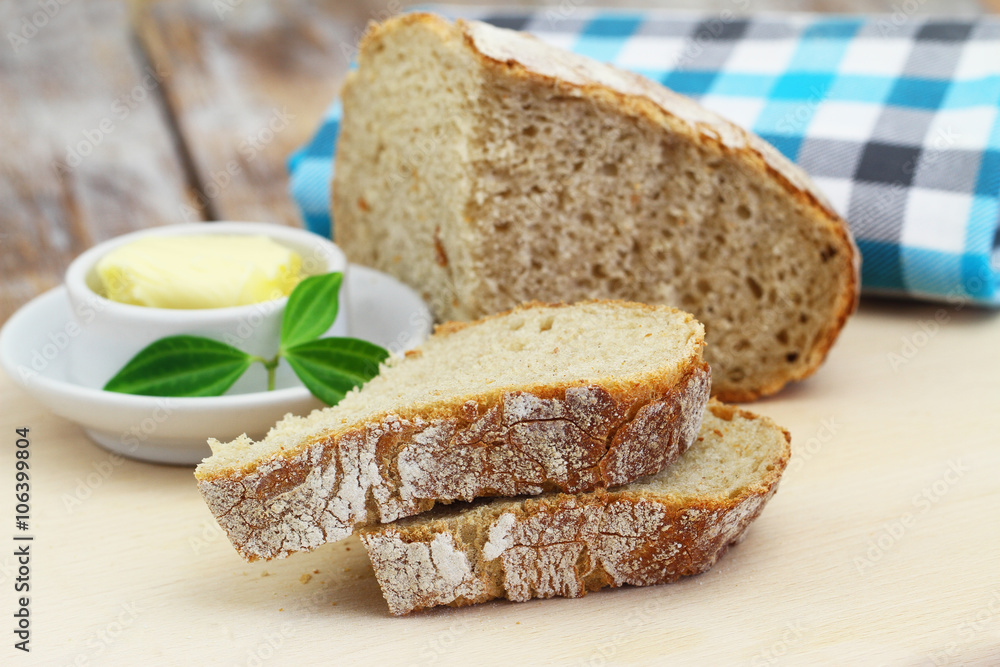 Slices of traditional rustic rye bread on wooden board
Slices of traditional rustic rye bread on wooden board