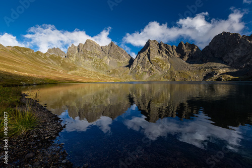 Fototapeta Naklejka Na Ścianę i Meble -  Picturesque lake in valley of Caucasus mountains in Georgia