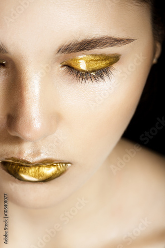Woman with gold make-up