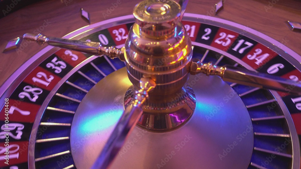 Roulette Wheel in a casino - spinning wheel Roulette Wheel in a casino - spinning wheel