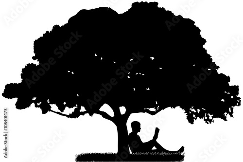 The man who is sitting under a tree and reading a book