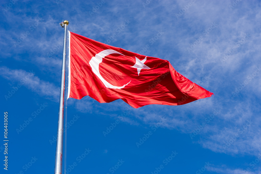 Turkish flag waving in blue sky, Izmir, TURKEY