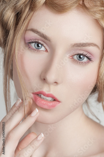 Portrait of beautiful woman with makeup and hairstyle