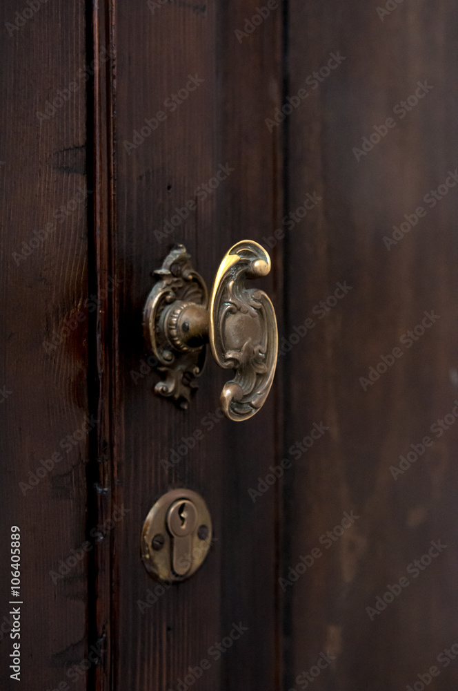 Old doorknobs, doorknockers and handles on ancient doors Old doorknobs, doorknockers and handles on ancient doors