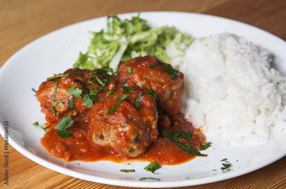 Meat balls with tomato sauce and white rice Meat balls with tomato sauce and white rice