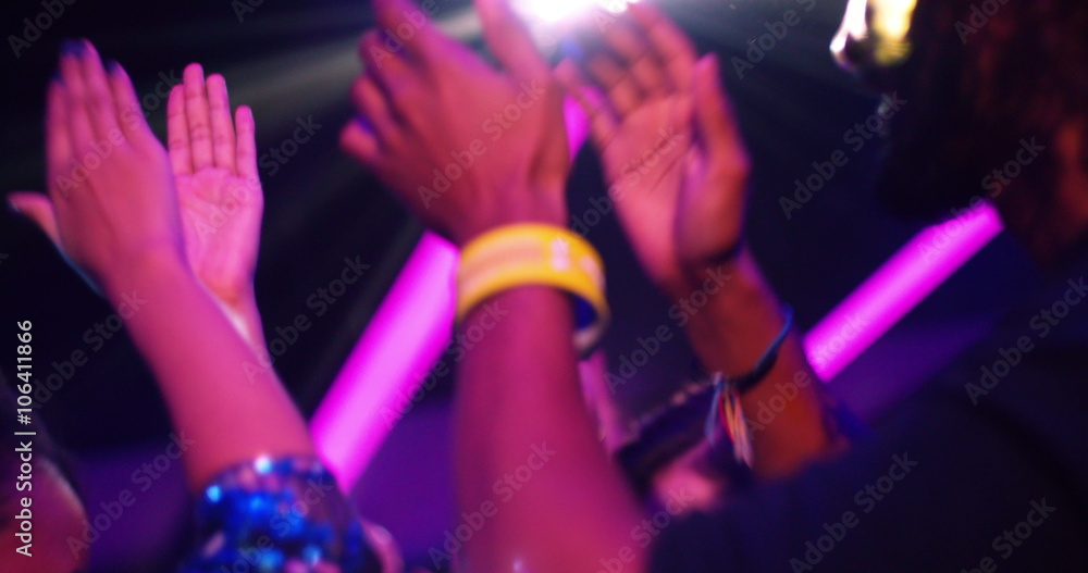 Stunning african-american woman clapping hands at party with friends
