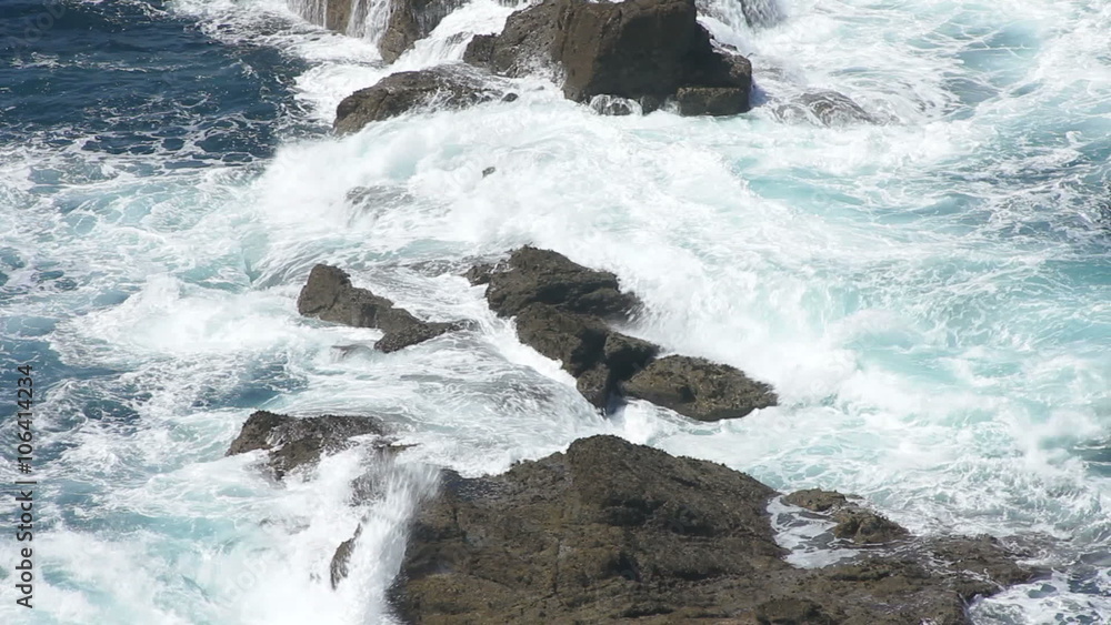 Waves crash onto rocks at Lands End Cornwall, England, UK. Waves crash onto rocks at Lands End Cornwall, England, UK.