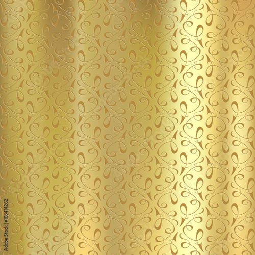 Geometric pattern on a gold plate. Engraving on metal.