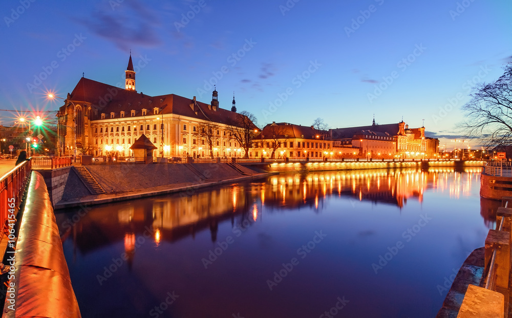The promenade of Wroclaw, view from river Odra, after sunset.