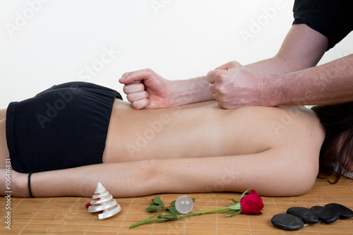 Woman is getting back massage from a physiotherapist.