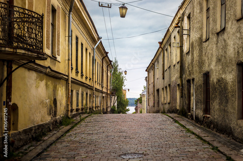 Cobbled road to the bay. Vyborg. Russia photo