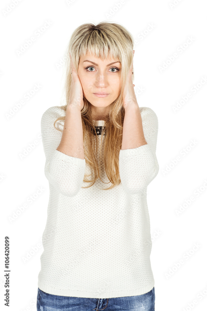 Portrait of young woman closes hands over her ears, she does not want to listen to. human emotion expression and lifestyle concept. image on a white studio background. Portrait of young woman closes hands over her ears, she does not want to listen to. human emotion expression and lifestyle concept. image on a white studio background.