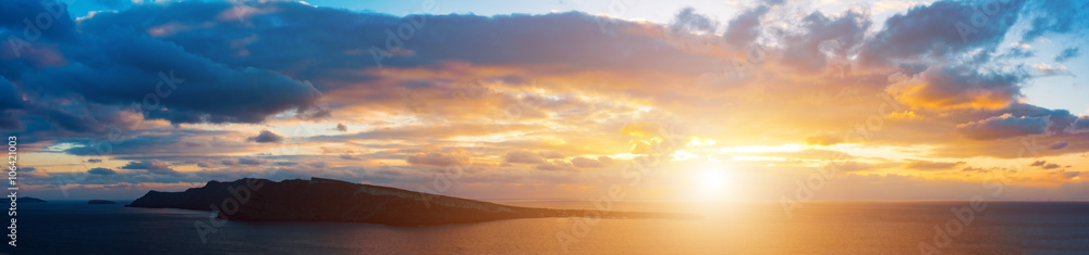 Sunset in sea and island on horizon Sunset in sea and island on horizon