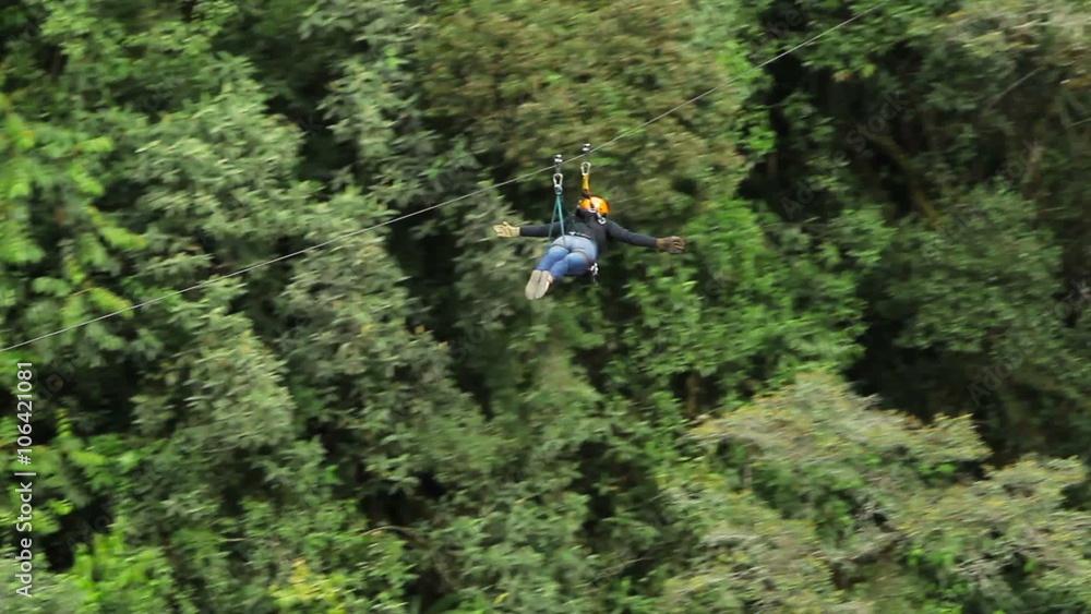 Experience the thrill of flying through the air like a superhero as women ride a zipline in a Superman position.