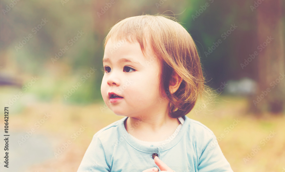 Happy toddler girl playing outside Happy toddler girl playing outside