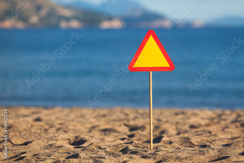 Road sign beach