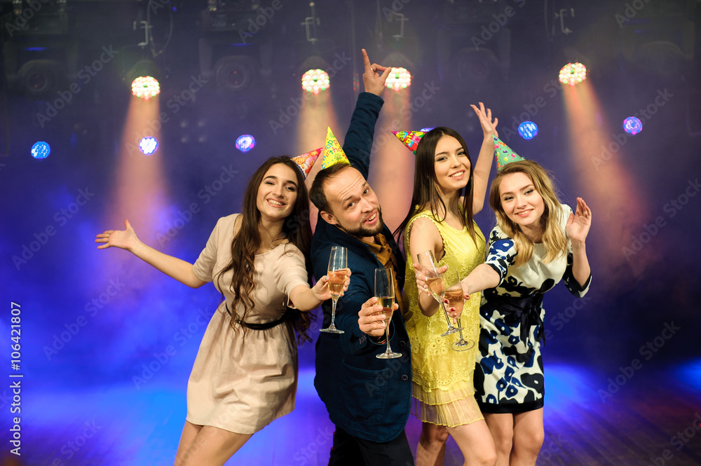 cheerful young company celebrates birthday in a nightclub cheerful young company celebrates birthday in a nightclub
