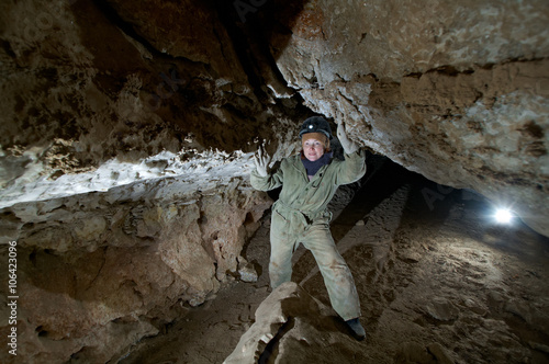  young female caver writing down cave