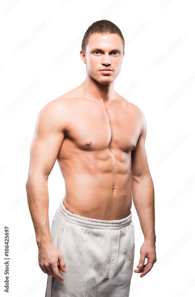 Fototapeta premium Strong, fit and sporty bodybuilder man isolated on white.