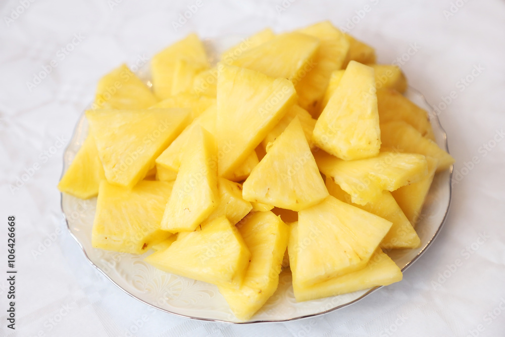 Sliced pineapple on a plate Sliced pineapple on a plate