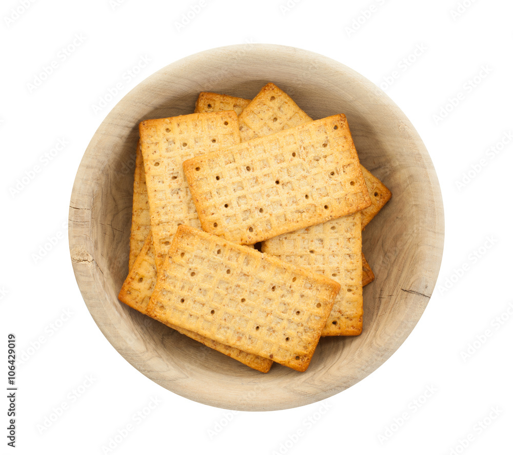 Simple crackers in a wooden bowl Simple crackers in a wooden bowl