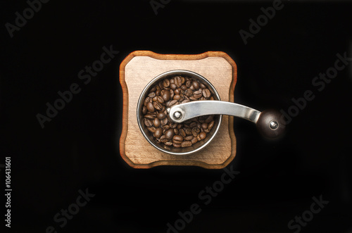 Coffee mill isolated on black background