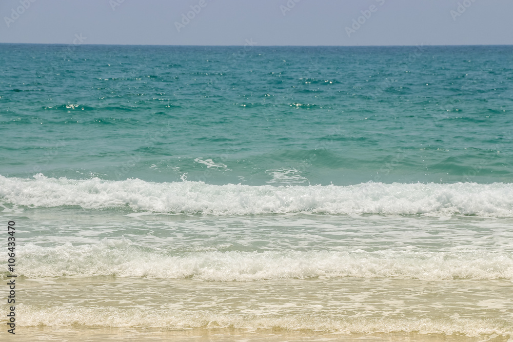 Sea wave on the sand beach