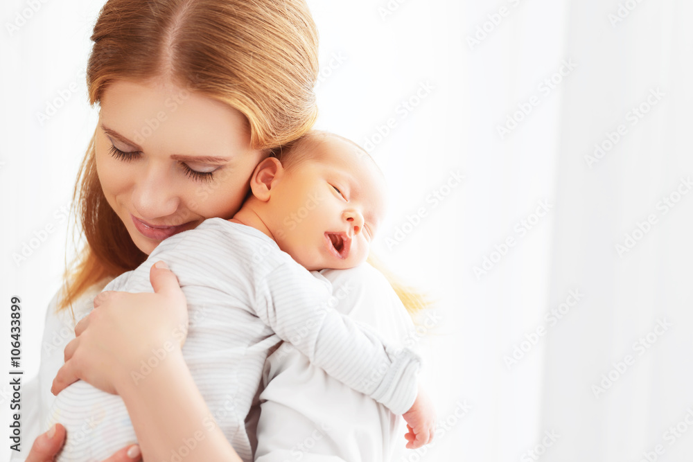 newborn baby in tender embrace of mother newborn baby in tender embrace of mother