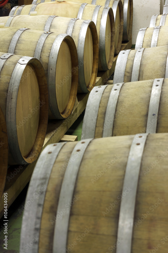 Closeup of  wooden barrels for maturing and storing wine 1