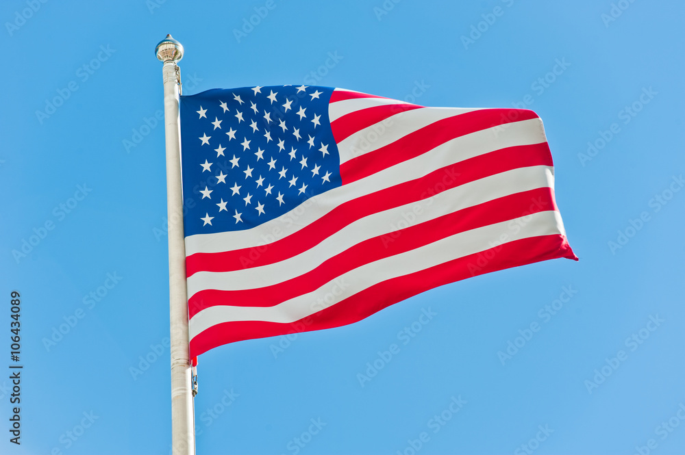 Obraz premium American flag against blue sky