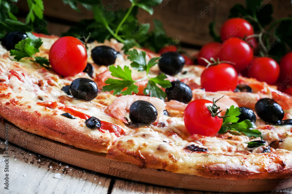 Pizza with seafood and black olives, selective focus Pizza with seafood and black olives, selective focus