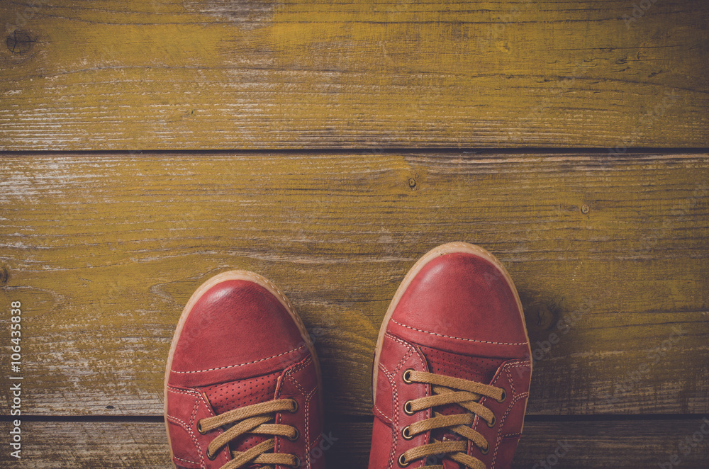 Red shoes on yellow wooden floor Red shoes on yellow wooden floor