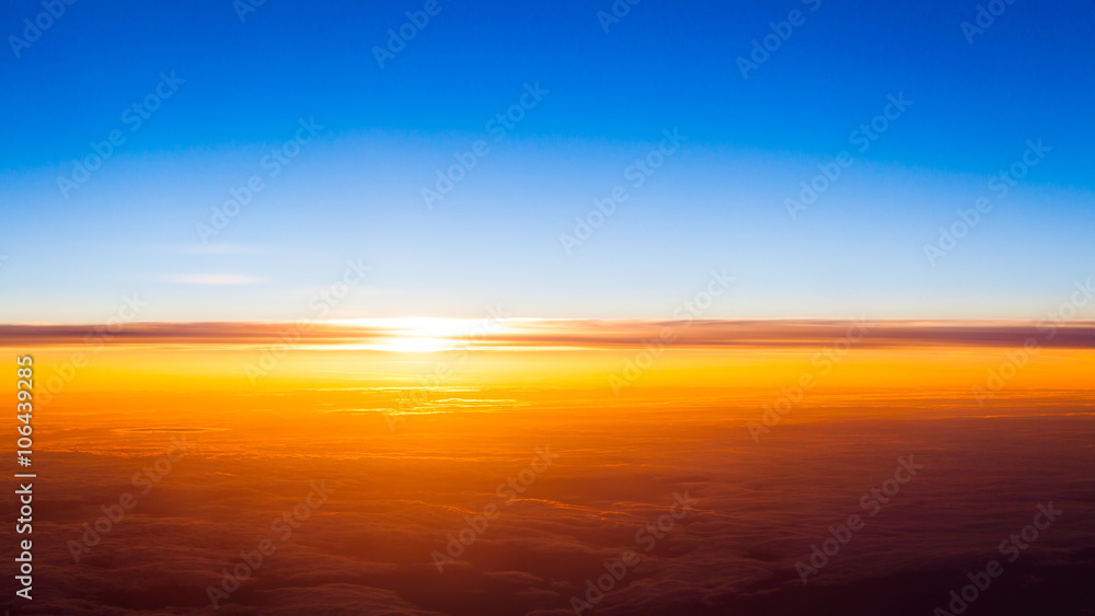 Sunset scene. Sunset above the clouds