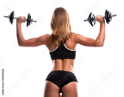 Sexy fitness girl with dumbbells © blackday