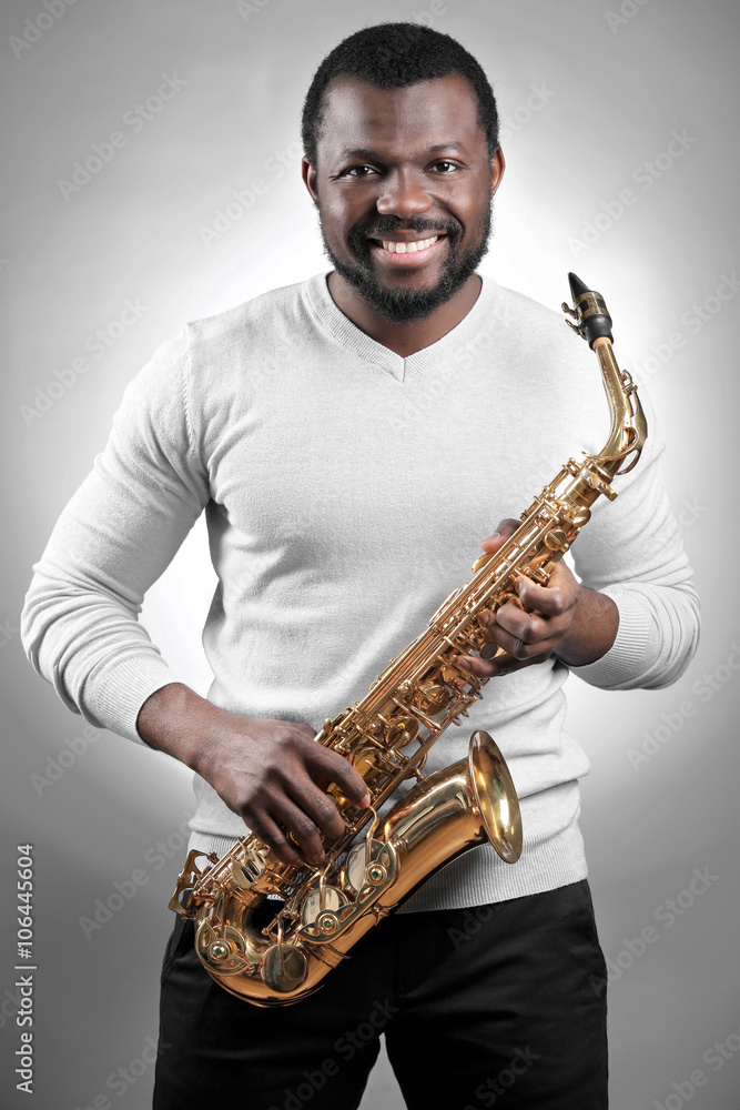Naklejka premium African American jazz musician playing the saxophone