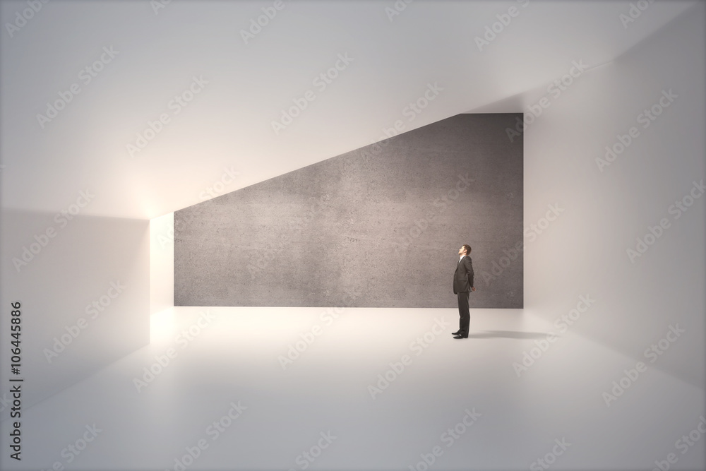 Concrete wall and businessman Concrete wall and businessman