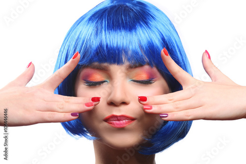 Beautiful girl with colorful makeup  manicure and blue wig  isolated on white
