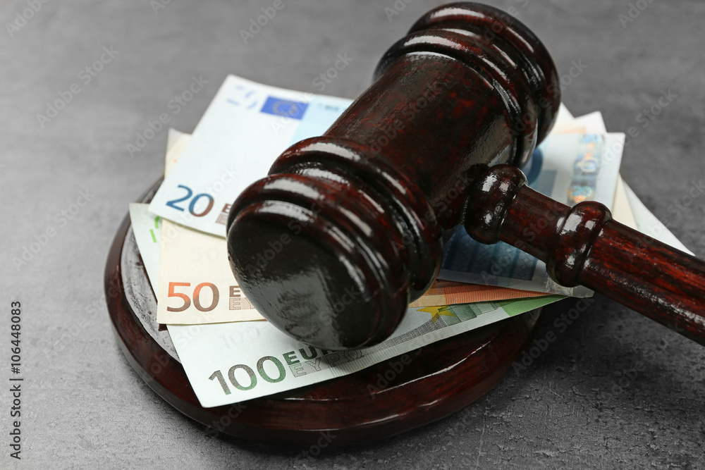 Law gavel with euro on grey background, closeup