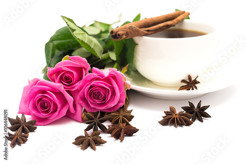 Cup of coffee with cinnamon and anise ; and bouquet of roses