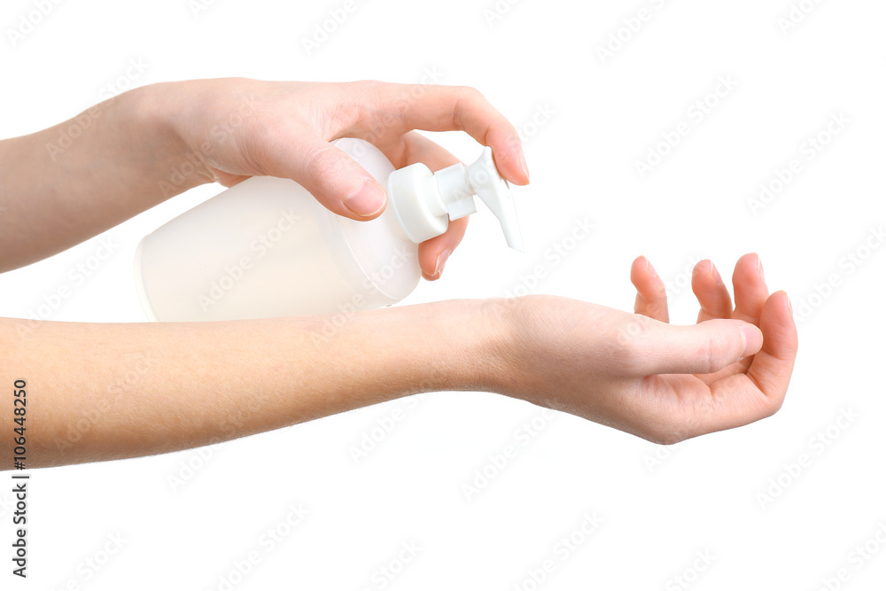 Beautiful female hands applying hand cream, isolated on white Beautiful female hands applying hand cream, isolated on white