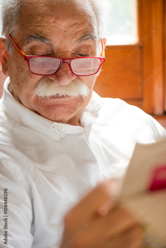 senior reading newspaper at home senior reading newspaper at home