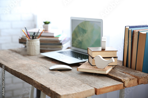 Workplace with laptop, tabl...
