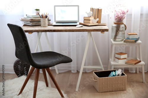 Workplace with laptop, tabl...