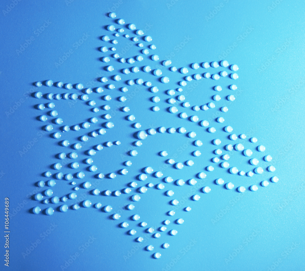 Flower made of water drops on blue background Flower made of water drops on blue background